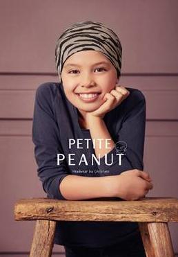 petit peanut - kind met tijgerprint mutsje